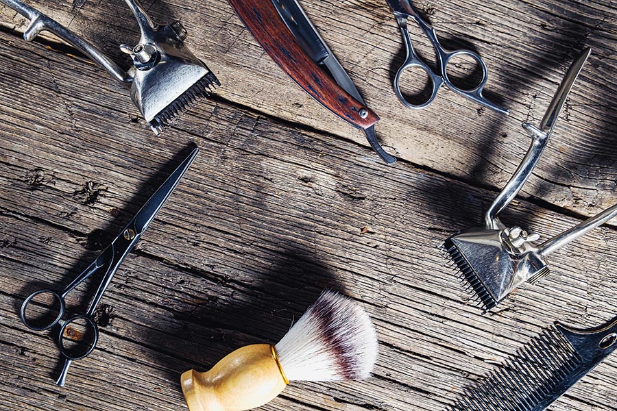 Specialized Business Insurance - Salon and Barber Tools Spread Out on Barn Wood